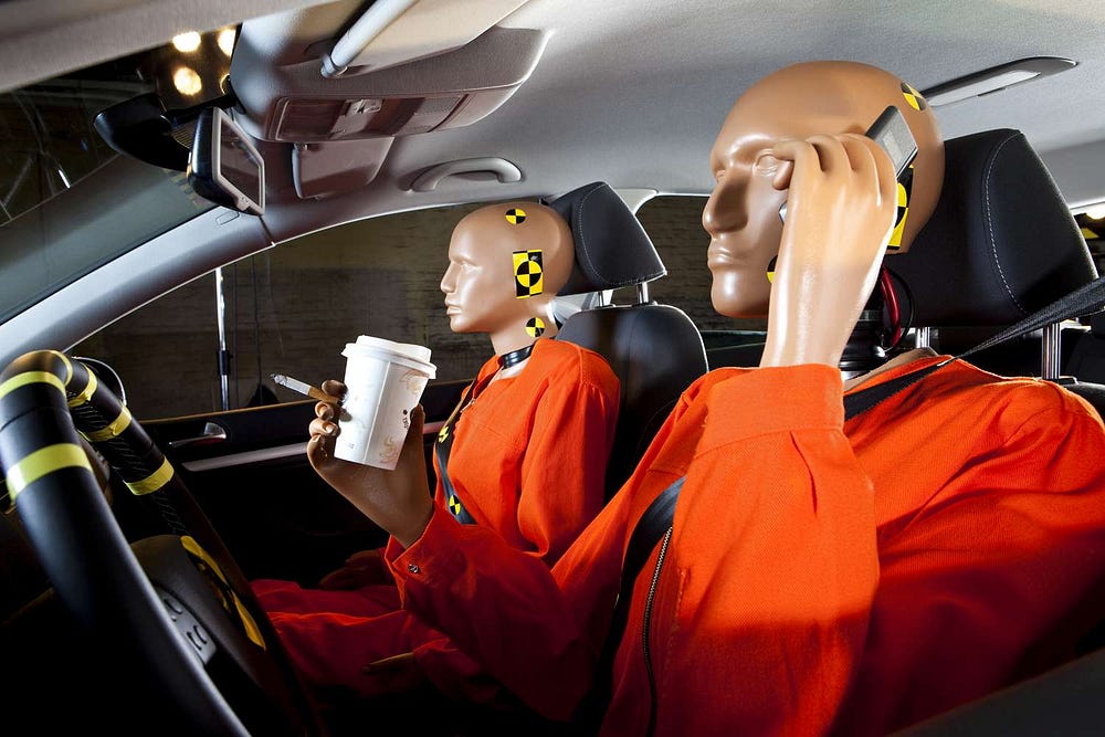 Crash test dummies in a car